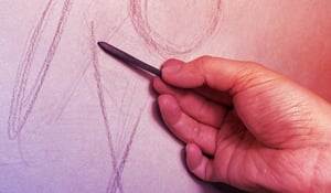 Hand holding charcoal