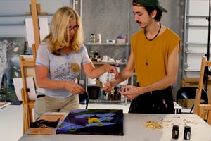 Artists working on painting 