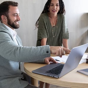 Man and woman working at computer 