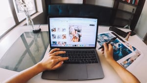 Hands in front of a computer