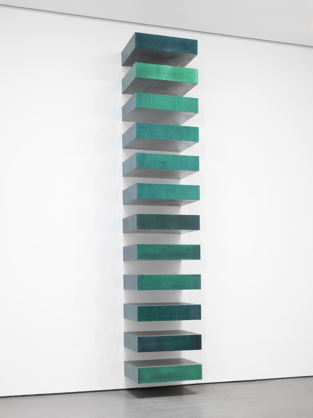 Donald Judd Untitled Stack of identical rectangular boxes mounted vertically on a wall at even intervals